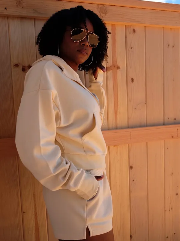 Shanté modeling a cream Cocoburry athleisure set, photo 9