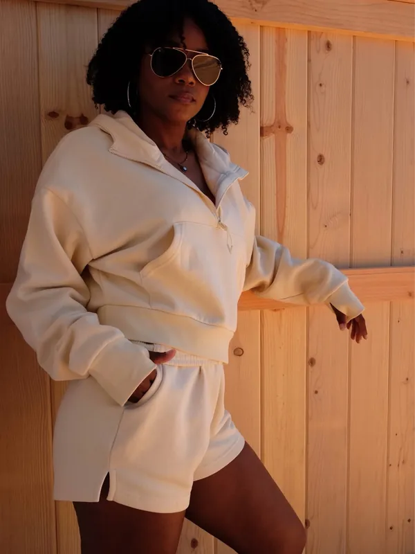 Shanté modeling a cream Cocoburry athleisure set, photo 10